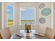 Inviting dining area with plenty of natural light and lovely views overlooking the golf course at 7705 Grand Estuary Trl # 202, Bradenton, FL 34212