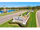 Attractive community entrance with lush landscaping and a welcoming sign at 7705 Grand Estuary Trl # 202, Bradenton, FL 34212