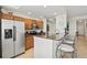 Well-equipped kitchen with stainless steel appliances, modern cabinetry, and bar seating for casual dining at 7705 Grand Estuary Trl # 202, Bradenton, FL 34212