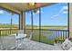 Relaxing lanai with outdoor seating and scenic waterfront views at 7705 Grand Estuary Trl # 202, Bradenton, FL 34212