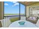 Relaxing lanai with outdoor seating and scenic water views at 7705 Grand Estuary Trl # 202, Bradenton, FL 34212