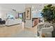 Spacious living room flows into the kitchen with a large sliding door to a lanai, perfect for seamless indoor/outdoor living at 7705 Grand Estuary Trl # 202, Bradenton, FL 34212