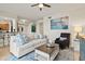 Comfortable living room open to the kitchen, complete with stylish seating and plenty of natural light at 7705 Grand Estuary Trl # 202, Bradenton, FL 34212