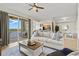 Open living area with balcony access, seamlessly connected to the kitchen, perfect for entertaining at 7705 Grand Estuary Trl # 202, Bradenton, FL 34212