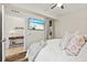 This beautiful bedroom has hardwood floors, a view to the office space, a large window and natural light at 7705 Grand Estuary Trl # 202, Bradenton, FL 34212