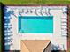 Aerial shot of a pool with lounge chairs, tables, a gazebo, and a manicured yard at 7705 Grand Estuary Trl # 202, Bradenton, FL 34212
