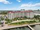 Condominium building aerial view shows the property's proximity to the waterway at 808 3Rd W Ave # 203, Bradenton, FL 34205