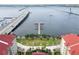A picturesque aerial captures the condo's waterfront setting, with a nearby marina and scenic bridge views at 808 3Rd W Ave # 203, Bradenton, FL 34205