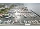 This aerial view captures a large marina filled with boats and yachts near the waterfront buildings at 808 3Rd W Ave # 203, Bradenton, FL 34205