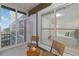 This relaxing screened lanai features comfortable seating and views of the community at 808 3Rd W Ave # 203, Bradenton, FL 34205