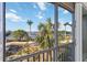 This spacious balcony offers lush tropical landscaping, bay views, and direct beach access at 808 3Rd W Ave # 203, Bradenton, FL 34205
