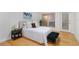 Comfortable bedroom featuring a plush bed, ample natural light, and stylish decor elements at 808 3Rd W Ave # 203, Bradenton, FL 34205