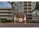 Beautiful condo building entrance with landscaping and covered entry to River Dance building in a waterfront community at 808 3Rd W Ave # 203, Bradenton, FL 34205