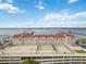 The condo's exterior boasts tennis and basketball courts, offering luxurious amenities and waterfront views at 808 3Rd W Ave # 203, Bradenton, FL 34205