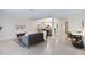 Open-concept living space featuring tile flooring, modern furnishings, and an abundance of natural light at 808 3Rd W Ave # 203, Bradenton, FL 34205