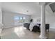 Bright living room with tile flooring, large windows with water views, and comfortable seating at 808 3Rd W Ave # 203, Bradenton, FL 34205