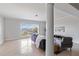 Bright living room with tile flooring, large windows with water views, and comfortable seating at 808 3Rd W Ave # 203, Bradenton, FL 34205