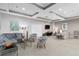 Inviting living room with comfortable seating, modern decor, and a mounted TV for relaxing and entertaining at 808 3Rd W Ave # 203, Bradenton, FL 34205