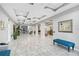 Bright and spacious lobby with tiled floors, comfortable seating, and arched doorways for a welcoming atmosphere at 808 3Rd W Ave # 203, Bradenton, FL 34205