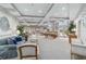 Well-lit lounge area featuring cozy sofas, stylish chairs, and a pool table for relaxing and entertaining guests at 808 3Rd W Ave # 203, Bradenton, FL 34205