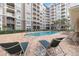 Exterior pool with lounge chairs at a condominium complex at 808 3Rd W Ave # 203, Bradenton, FL 34205