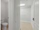 Bright walk-in closet featuring tile flooring, closet doors and wire shelving for ample storage at 808 3Rd W Ave # 203, Bradenton, FL 34205