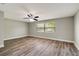 Bright, spacious bedroom with hard-wood flooring and natural light streaming in through the window at 8308 Pelican Rd, Englewood, FL 34224