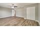 Spacious bedroom with hard-wood flooring, large closet, and ceiling fan at 8308 Pelican Rd, Englewood, FL 34224
