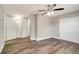 This bedroom offers ample closet space, a ceiling fan, and stylish and modern hard-wood flooring at 8308 Pelican Rd, Englewood, FL 34224