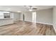 Open-concept living space with luxury vinyl plank flooring and a view of the kitchen at 8308 Pelican Rd, Englewood, FL 34224