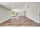 Expansive living area boasting recessed lighting, luxury vinyl plank floors, and access to the outdoors at 8308 Pelican Rd, Englewood, FL 34224