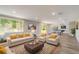 Bright, expansive living room with a pool table and comfortable seating area at 8308 Pelican Rd, Englewood, FL 34224