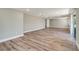 Spacious living area offering plenty of natural light and luxury vinyl plank flooring at 8308 Pelican Rd, Englewood, FL 34224