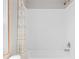 Bright bathroom featuring a clean, white tub and shower with decorative shower curtain at 8414 Sweden Blvd, Punta Gorda, FL 33982
