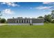 Charming single-story home featuring a well-maintained lawn and classic design elements at 8414 Sweden Blvd, Punta Gorda, FL 33982