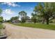 Exterior view of charming homes set in a serene, tree-filled landscape at 8414 Sweden Blvd, Punta Gorda, FL 33982