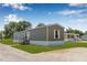 Charming single-story home with a well-maintained lawn and inviting front entrance at 8414 Sweden Blvd, Punta Gorda, FL 33982