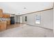 The open-concept design combines the living room and kitchen, bathed in natural light from multiple windows at 8414 Sweden Blvd, Punta Gorda, FL 33982