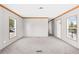 A well-lit living room with natural light, neutral paint, and front door at 8414 Sweden Blvd, Punta Gorda, FL 33982