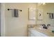 This well-lit bathroom has a single sink vanity and modern fixtures at 9034 Midnight Pass Rd # 6, Sarasota, FL 34242
