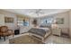 Serene bedroom with natural light, a comfortable bed, and calming decor for a restful atmosphere at 9034 Midnight Pass Rd # 6, Sarasota, FL 34242