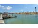 Scenic waterfront view featuring a dock and colorful building at 9034 Midnight Pass Rd # 6, Sarasota, FL 34242