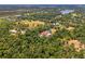 Expansive aerial view of a stunning secluded estate surrounded by lush greenery and mature trees at 95 Vic Edwards Rd, Sarasota, FL 34240