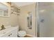 Bathroom featuring a vanity, toilet, and walk-in shower with tiled walls at 95 Vic Edwards Rd, Sarasota, FL 34240
