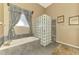 Well lit bathroom with a glass block shower and tub and large window at 95 Vic Edwards Rd, Sarasota, FL 34240