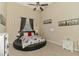 Unique bedroom features city themed decor, neutral walls, a ceiling fan, and a comfortable round bed at 95 Vic Edwards Rd, Sarasota, FL 34240