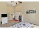 Neutral bedroom features city themed decor, neutral walls, a ceiling fan, and closet at 95 Vic Edwards Rd, Sarasota, FL 34240