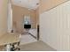 Bright bedroom features neutral walls, a ceiling fan, a comfortable bed, and a spacious closet for ample storage at 95 Vic Edwards Rd, Sarasota, FL 34240