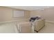 Versatile bonus room with movie screen featuring a comfortable seating area, a bed, and flexible space for various activities at 95 Vic Edwards Rd, Sarasota, FL 34240