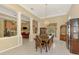 Formal dining room featuring ample space, decorative columns, and a stylish chandelier at 95 Vic Edwards Rd, Sarasota, FL 34240